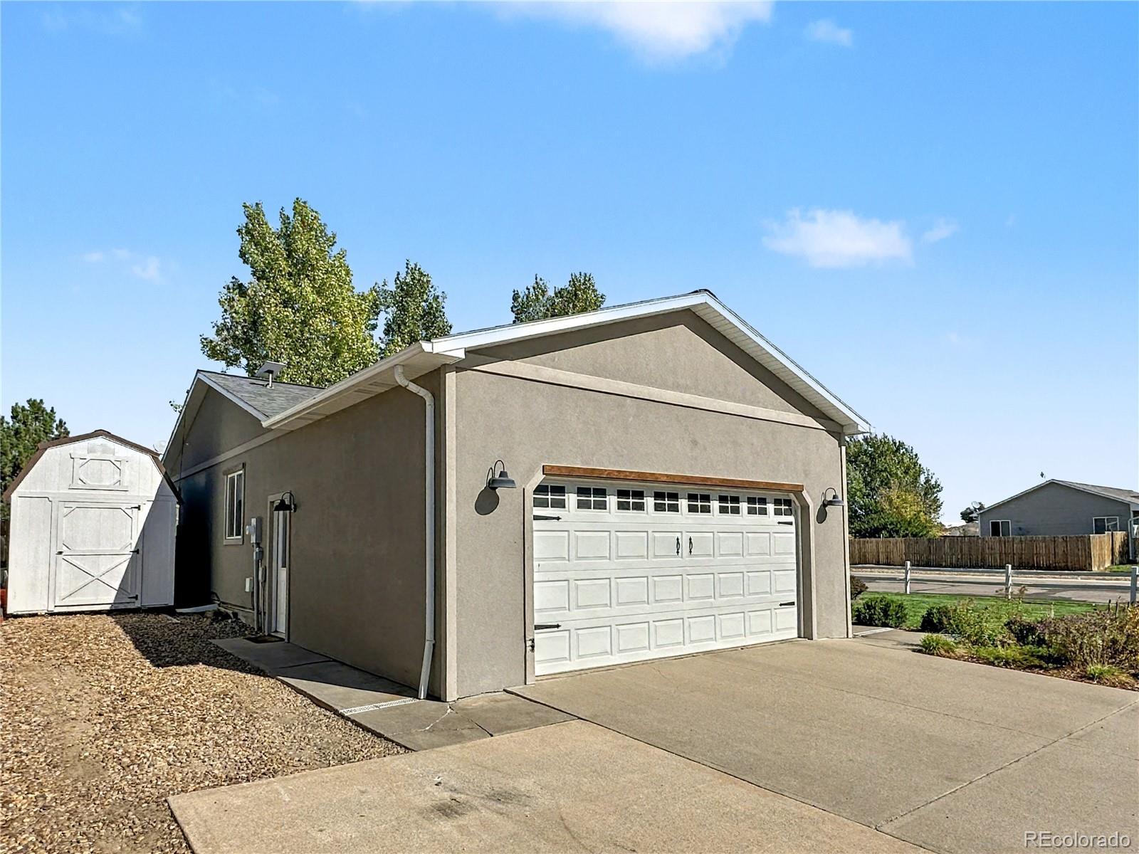 804 Nicole Road Sterling, CO 80751 - Photo 24 of 24 a view of a house with a garage