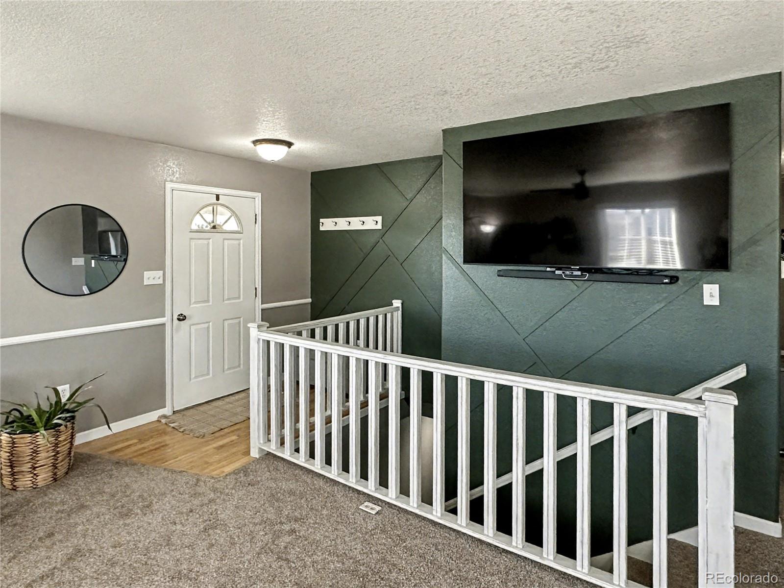 804 Nicole Road Sterling, CO 80751 - Photo 5 of 24 a view of a livingroom with furniture and staircase