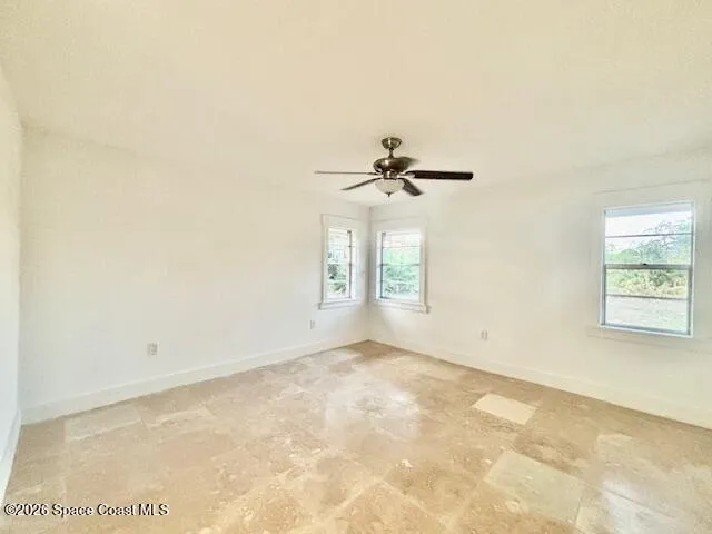 a spacious bathroom with a granite countertop sink mirror and a