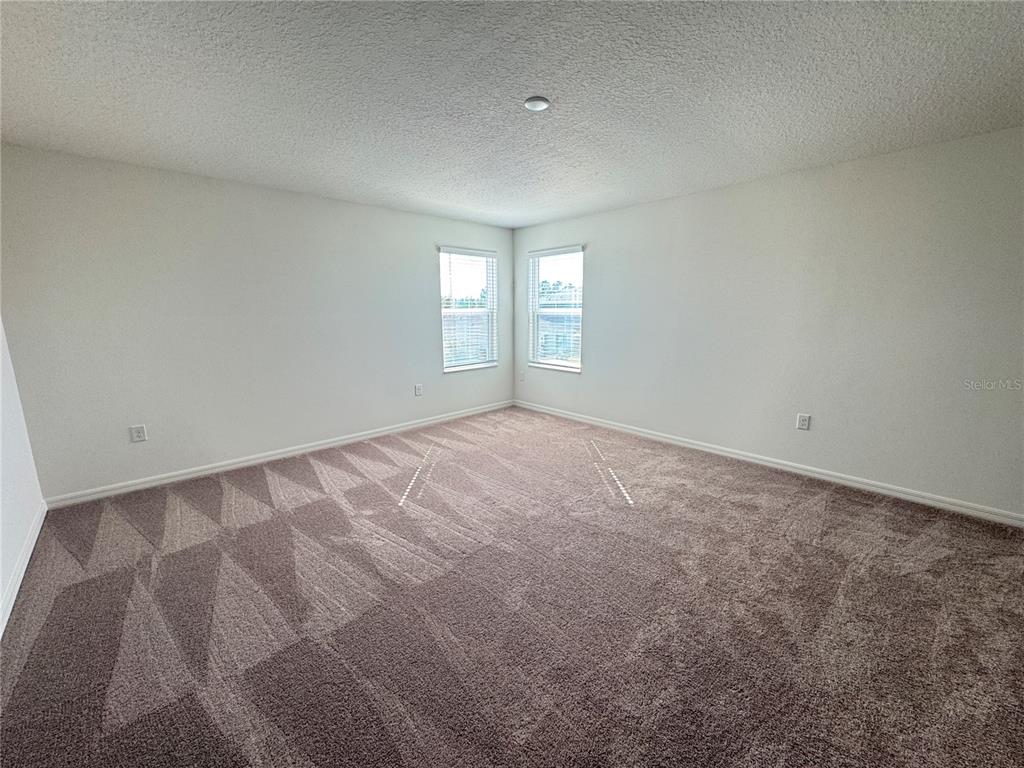 3820 Elk Blf Road St. Cloud, FL 34772 - Photo 14 of 23 an empty room with windows