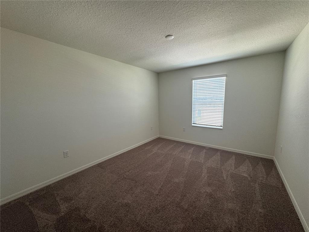 3820 Elk Blf Road St. Cloud, FL 34772 - Photo 19 of 23 an empty room with a window