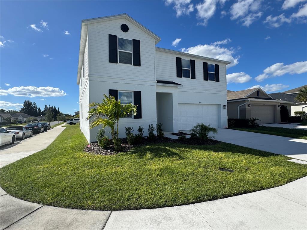 3820 Elk Blf Road St. Cloud, FL 34772 - Photo 2 of 23 a front view of a house with a yard