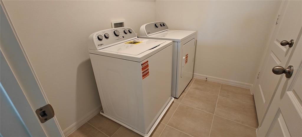 3820 Elk Blf Road St. Cloud, FL 34772 - Photo 23 of 23 a utility room with dryer and washer