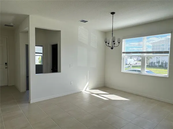 en empty room with windows and closet