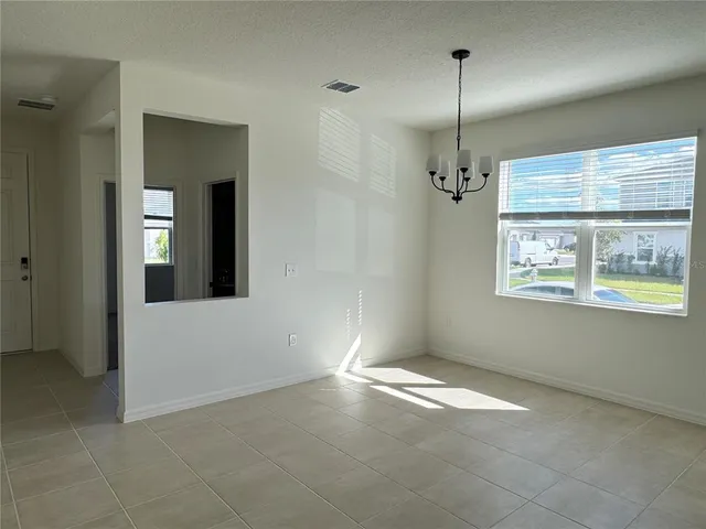 en empty room with windows and closet