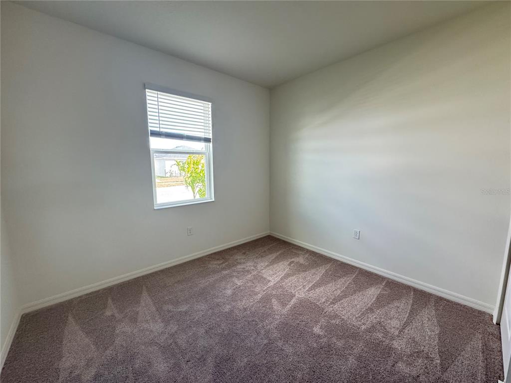 3820 Elk Blf Road St. Cloud, FL 34772 - Photo 6 of 23 an empty room with a window