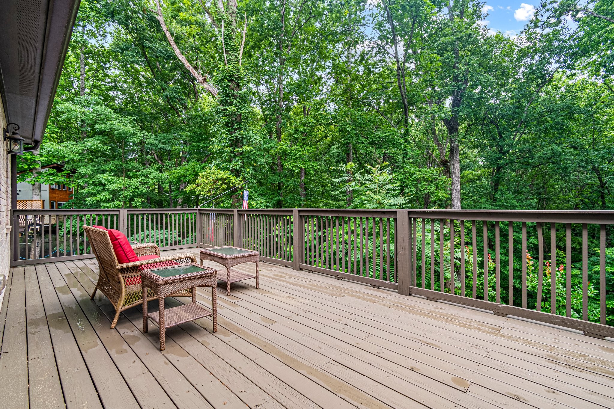 4545 Sears Road Pegram, TN 37143 - Photo 14 of 68 a wooden deck with a bench and white wooden fence