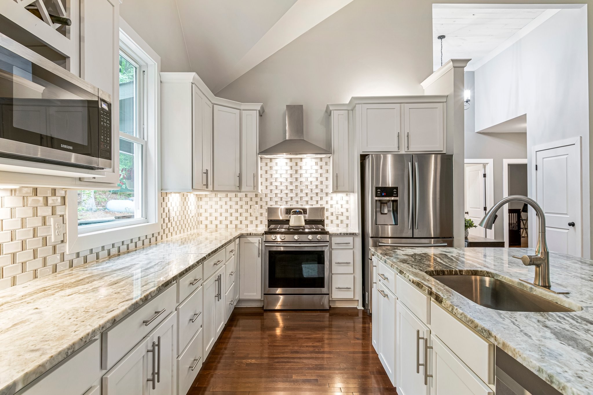 4545 Sears Road Pegram, TN 37143 - Photo 19 of 68 a kitchen with stainless steel appliances granite countertop a sink stove and refrigerator