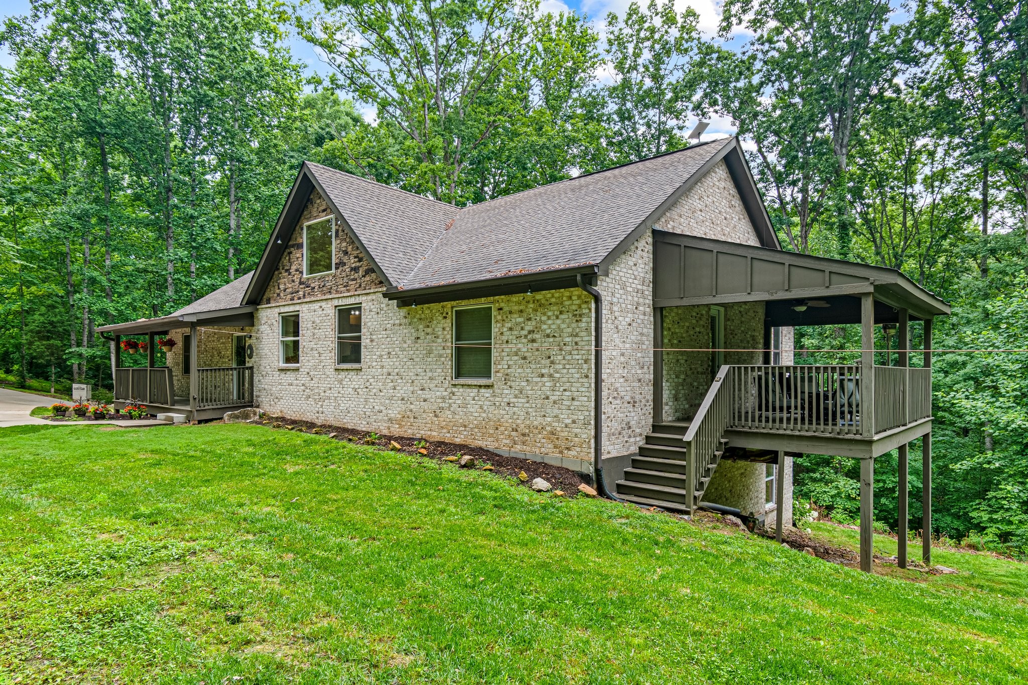 4545 Sears Road Pegram, TN 37143 - Photo 3 of 68 a front view of a house with a garden