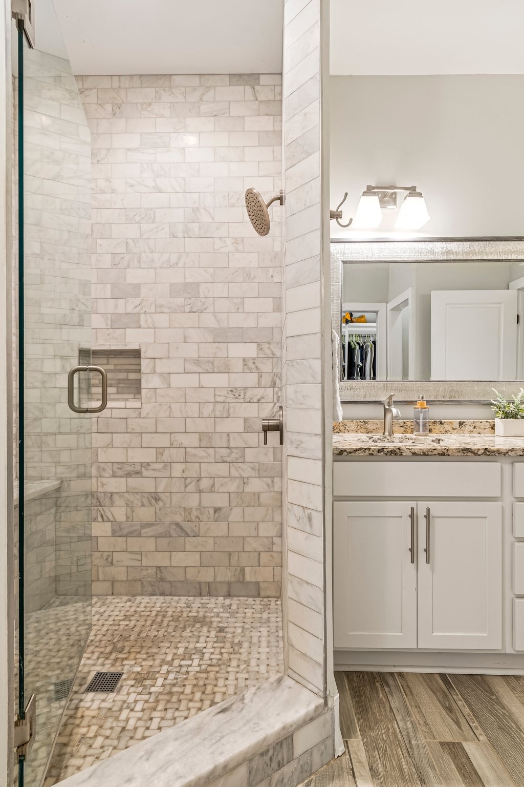 4545 Sears Road Pegram, TN 37143 - Photo 31 of 68 a bathroom with a granite countertop sink a mirror and shower