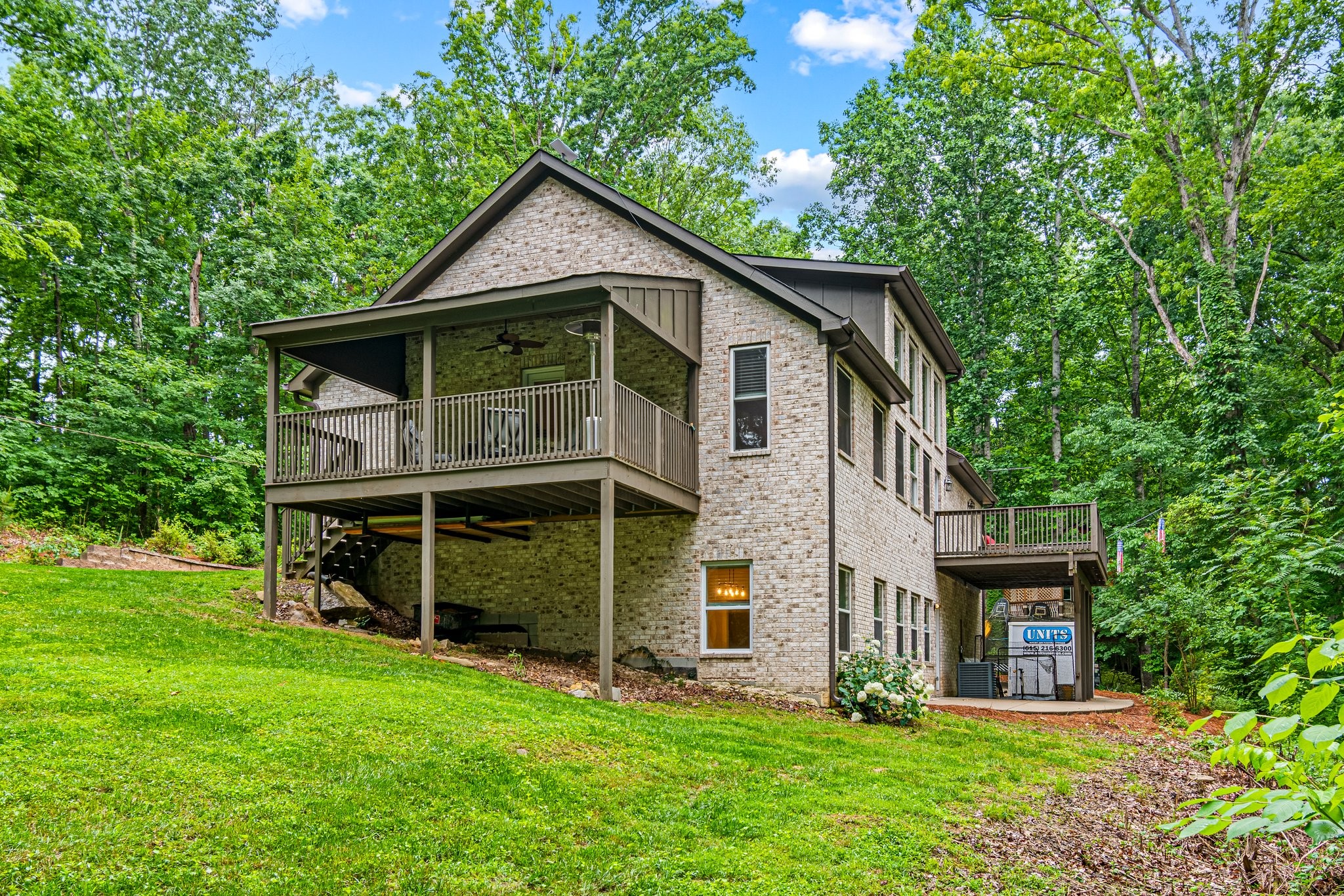 4545 Sears Road Pegram, TN 37143 - Photo 4 of 68 a front view of a house with a garden and plants