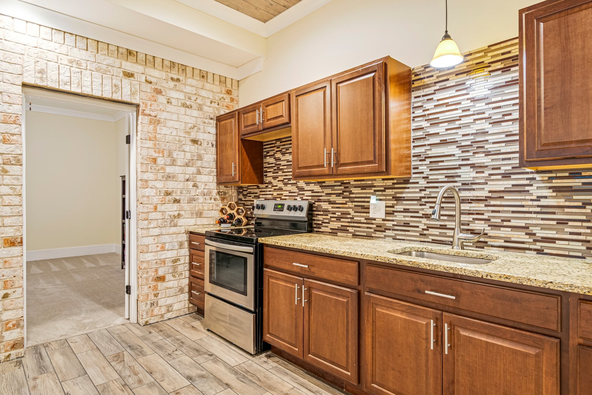 4545 Sears Road Pegram, TN 37143 - Photo 44 of 68 a kitchen with stainless steel appliances granite countertop a sink a stove and cabinets