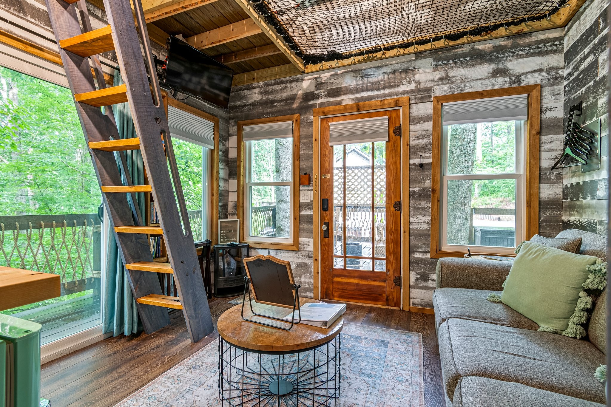 4545 Sears Road Pegram, TN 37143 - Photo 62 of 68 a living room with furniture a rug and a floor to ceiling window