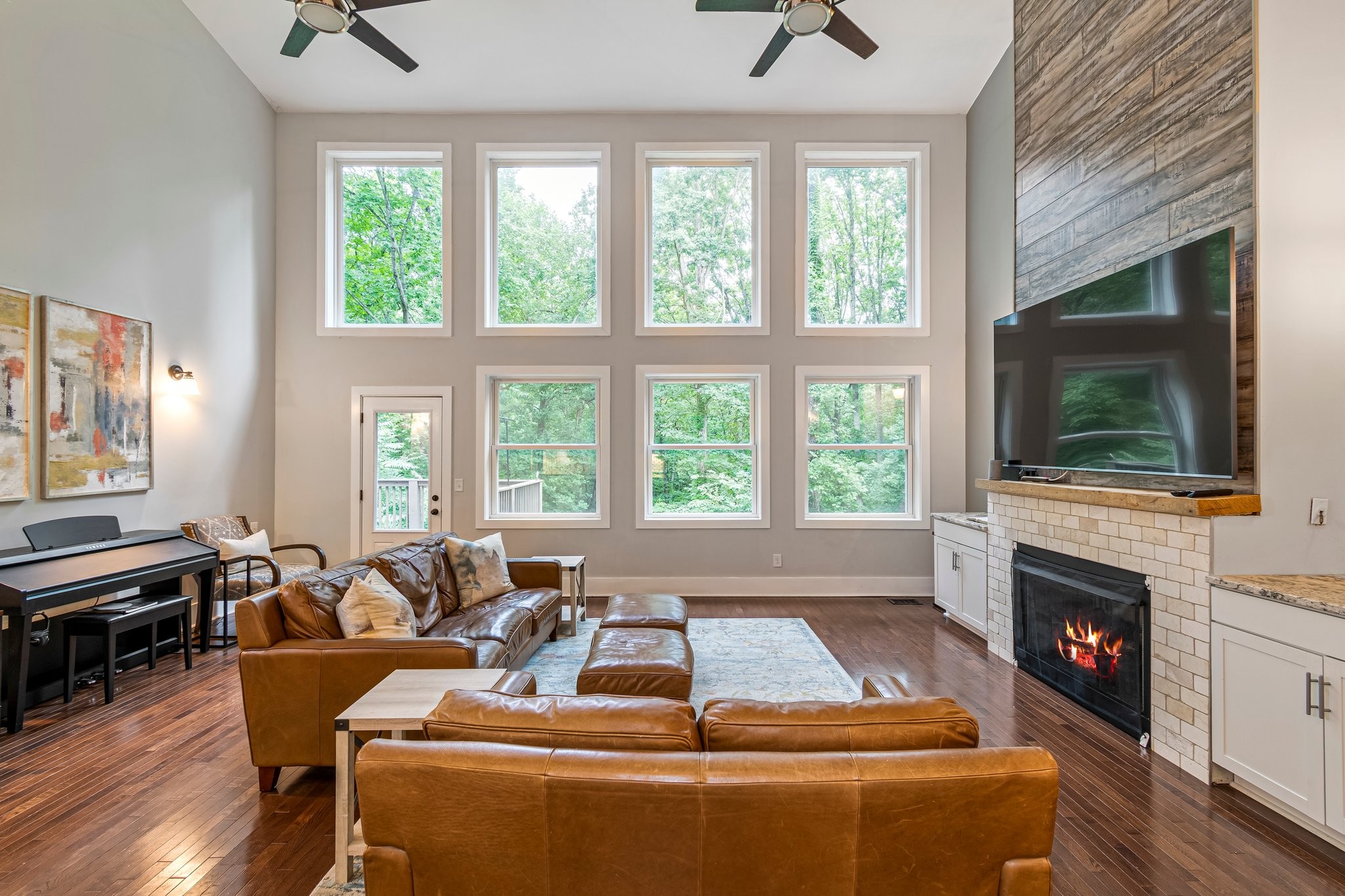 4545 Sears Road Pegram, TN 37143 - Photo 10 of 68 a living room with furniture a flat screen tv and a fireplace