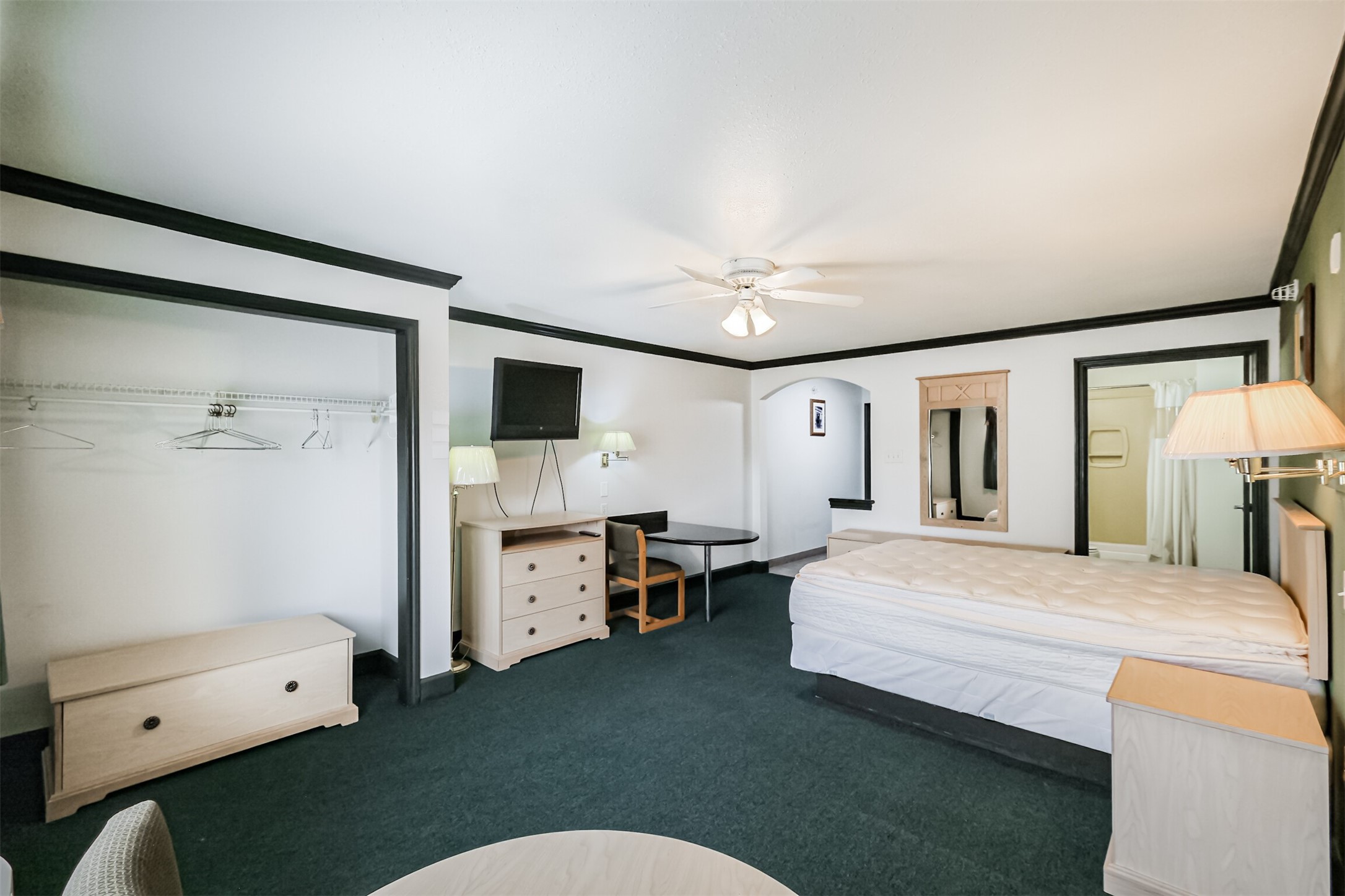 1025 Swanson Street, Unit 208 Houston, TX 77030 - Photo 15 of 19 a bedroom with a bed dresser and a window