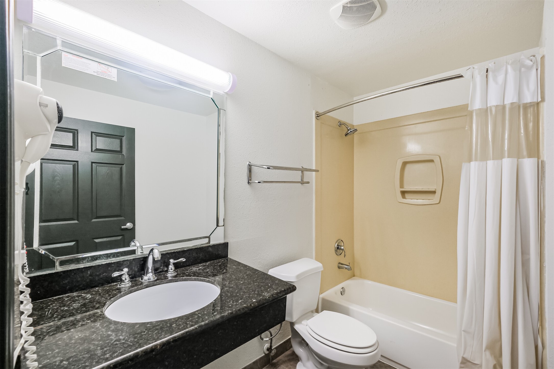 1025 Swanson Street, Unit 208 Houston, TX 77030 - Photo 16 of 19 a bathroom with a granite countertop sink toilet tub and shower
