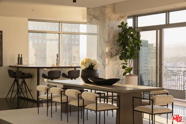 a view of a dining room with furniture window and outside view