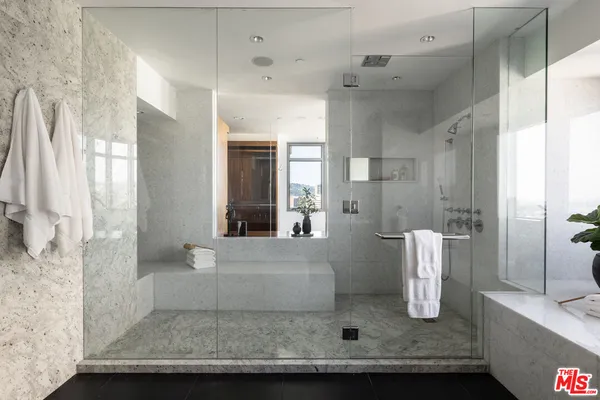 a view of a bathroom with a tub shower and sink