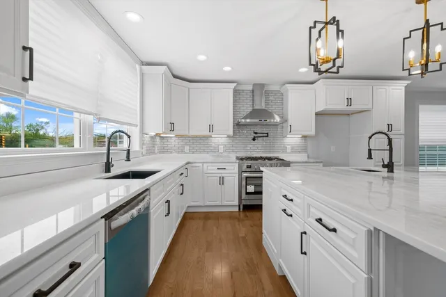 a kitchen with a sink stove and cabinets