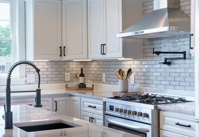 a kitchen with a stove and cabinets