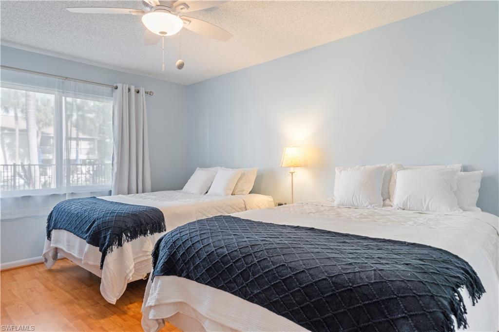 3200 Binnacle Drive, Unit C1 Naples, FL 34103 - Photo 16 of 37 a bedroom with a bed and window