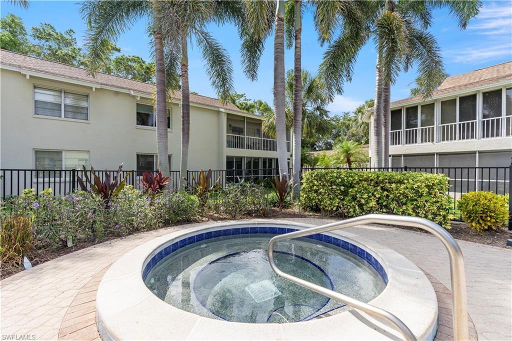 3200 Binnacle Drive, Unit C1 Naples, FL 34103 - Photo 23 of 37 a view of outdoor space yard and swimming pool