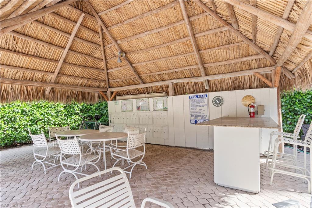 3200 Binnacle Drive, Unit C1 Naples, FL 34103 - Photo 27 of 37 a view of a room with lots of furniture and refrigerator
