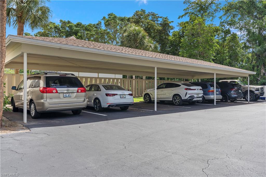 3200 Binnacle Drive, Unit C1 Naples, FL 34103 - Photo 29 of 37 a view of a cars parked in garage