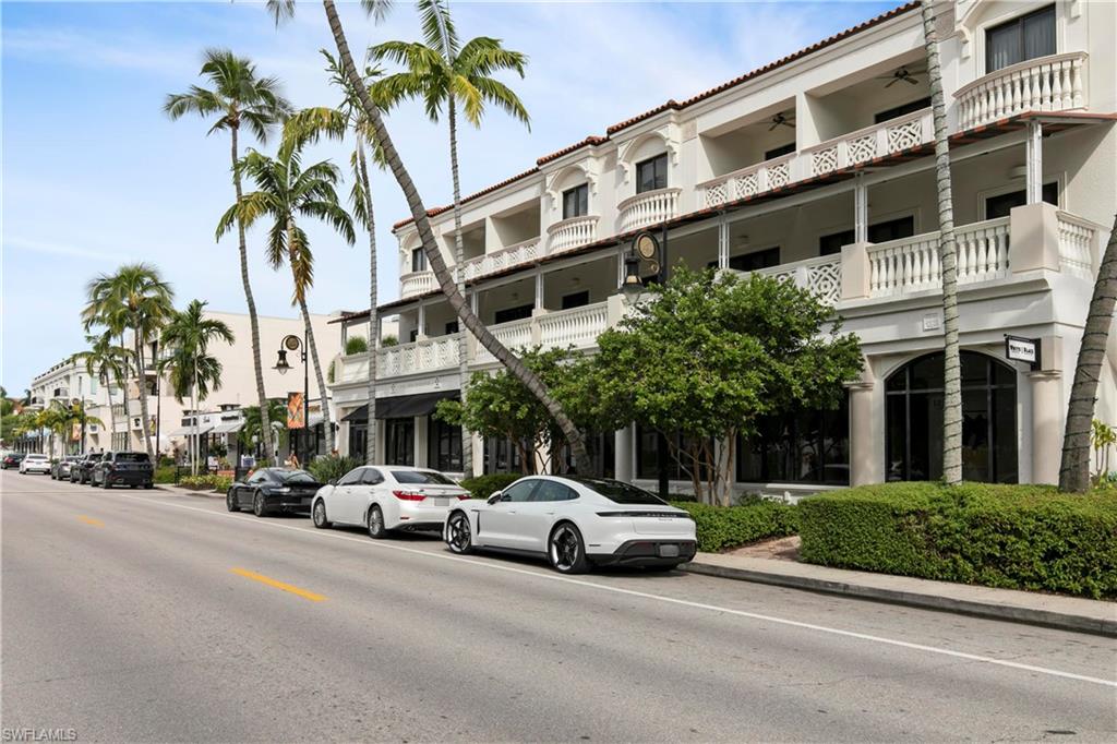3200 Binnacle Drive, Unit C1 Naples, FL 34103 - Photo 35 of 37 a view of a cars park in front of a building