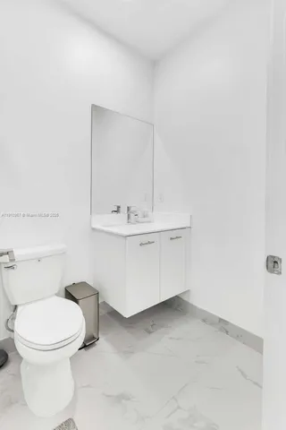 a bedroom with a bed couch and window