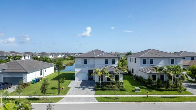 a front view of house with yard and outdoor seating