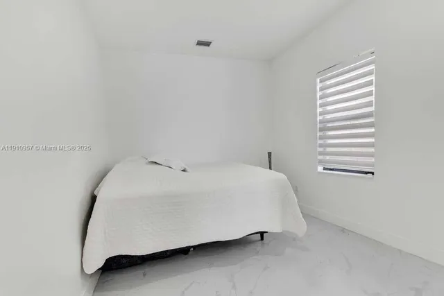 a view of living room kitchen with furniture and flat screen tv
