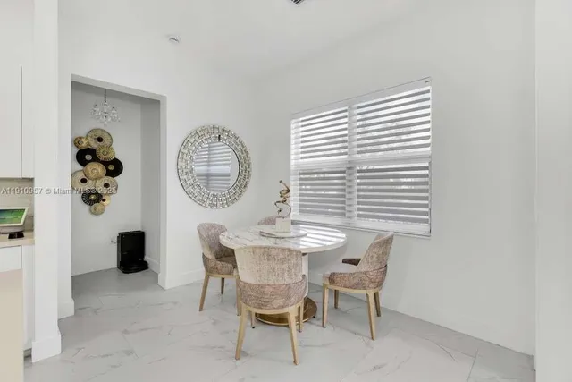 a living room with furniture and stairs