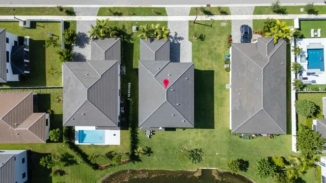 an aerial view of residential houses with city view