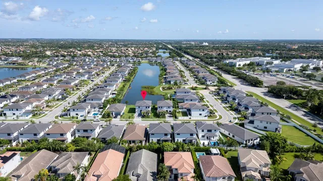 an aerial view of residential houses with outdoor space
