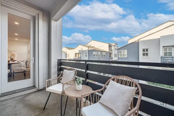 a terrace with a table and chairs