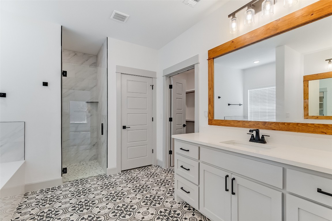 825 County Road 3152 Kempner, TX 76539 - Photo 15 of 34 a bathroom with a shower sink and mirror