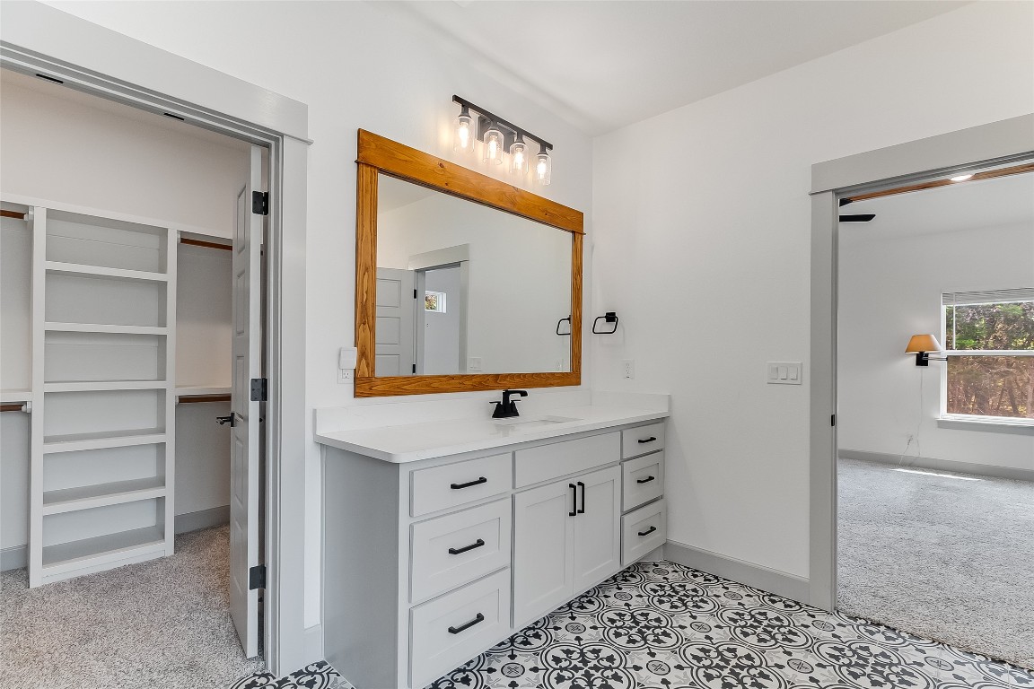 825 County Road 3152 Kempner, TX 76539 - Photo 17 of 34 a bathroom with a sink a vanity and a mirror