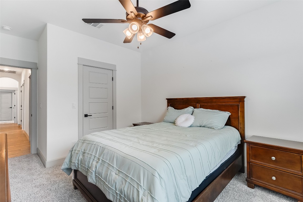 825 County Road 3152 Kempner, TX 76539 - Photo 26 of 34 a bedroom with a bed and a ceiling fan