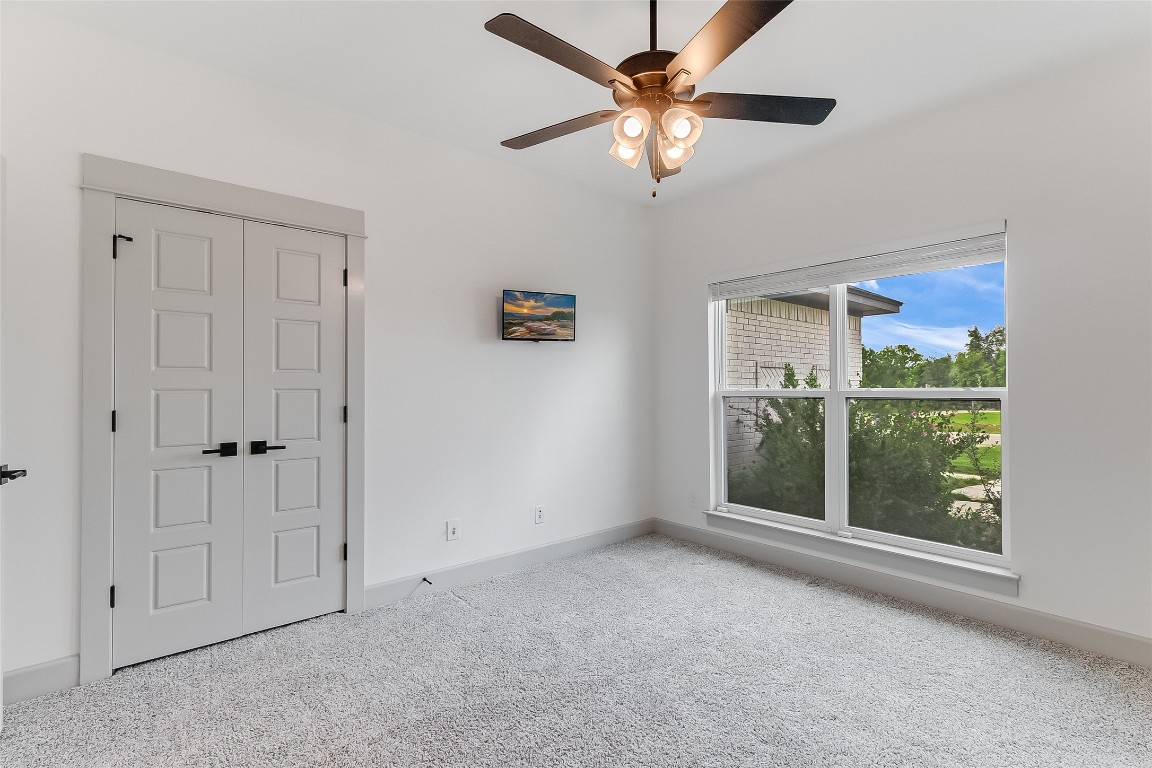 825 County Road 3152 Kempner, TX 76539 - Photo 27 of 34 an empty room with windows and fan