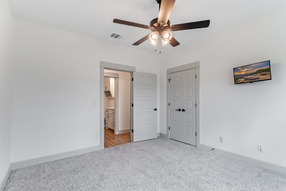 825 County Road 3152 Kempner, TX 76539 - Photo 28 of 34 an empty room with closet and a chandelier fan