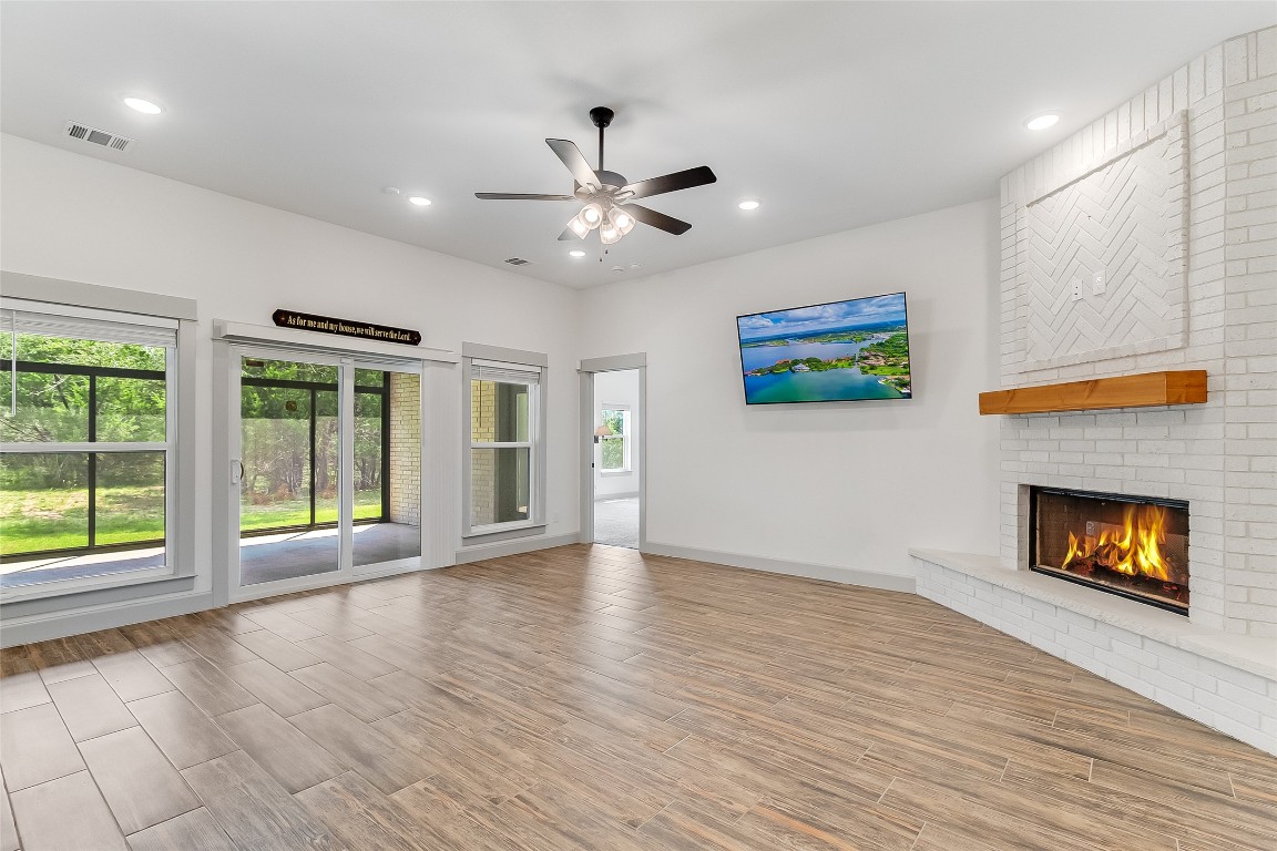 825 County Road 3152 Kempner, TX 76539 - Photo 5 of 34 a view of an empty room with a fireplace and a window