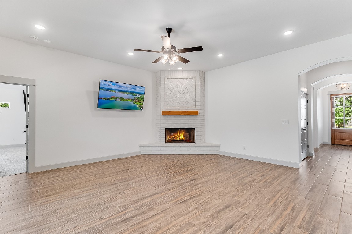 825 County Road 3152 Kempner, TX 76539 - Photo 6 of 34 an empty room with wooden floor ceiling fan and window