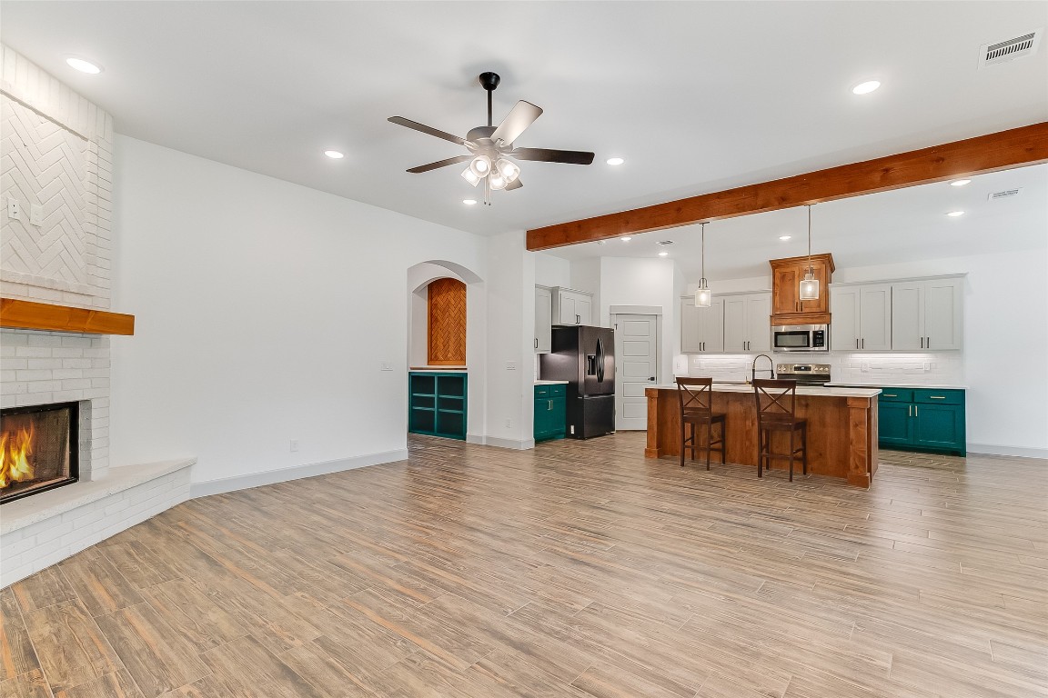 825 County Road 3152 Kempner, TX 76539 - Photo 7 of 34 a view of kitchen with a sink and a fireplace