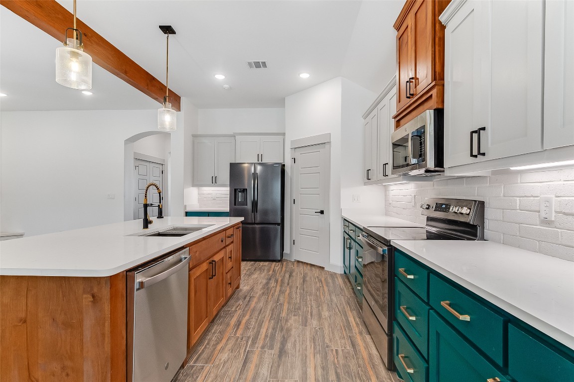 825 County Road 3152 Kempner, TX 76539 - Photo 10 of 34 a kitchen with stainless steel appliances granite countertop a sink a stove and a refrigerator
