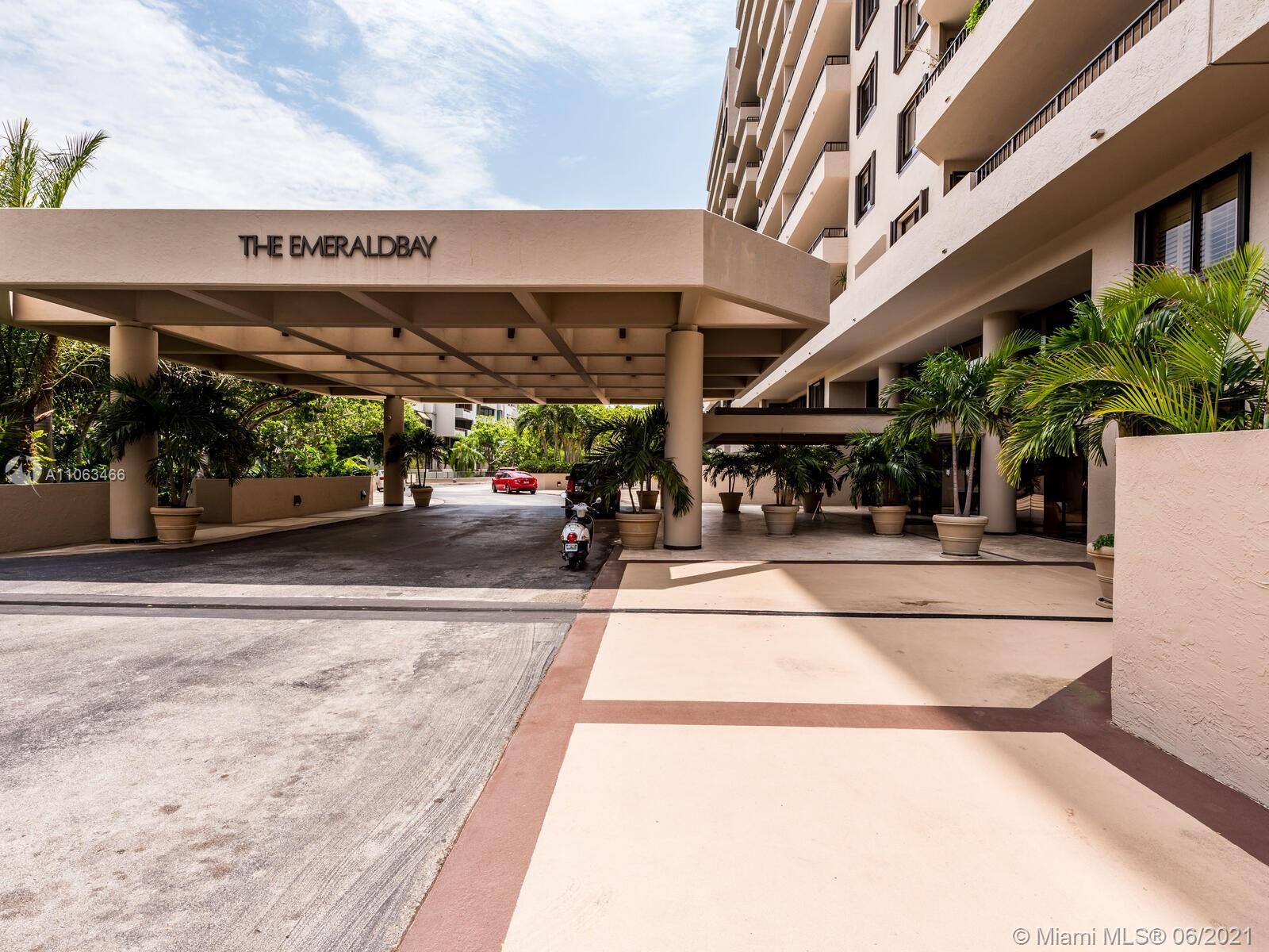 151 Crandon Boulevard, Unit 736 Key Biscayne, FL 33149 - Photo 2 of 38 a view of a building with car parked