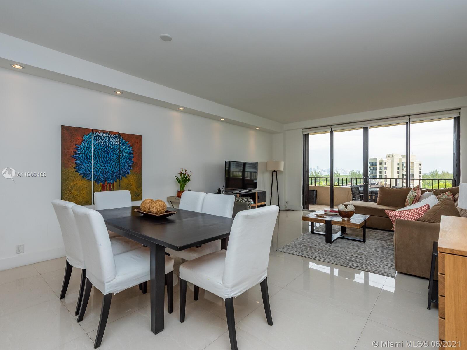 151 Crandon Boulevard, Unit 736 Key Biscayne, FL 33149 - Photo 13 of 38 a dining room with furniture and a large window