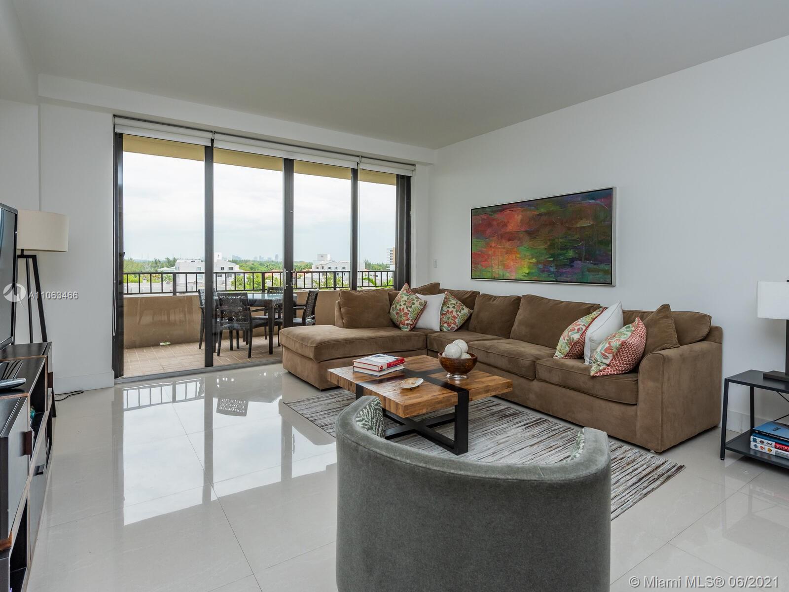 151 Crandon Boulevard, Unit 736 Key Biscayne, FL 33149 - Photo 15 of 38 a living room with furniture and a floor to ceiling window