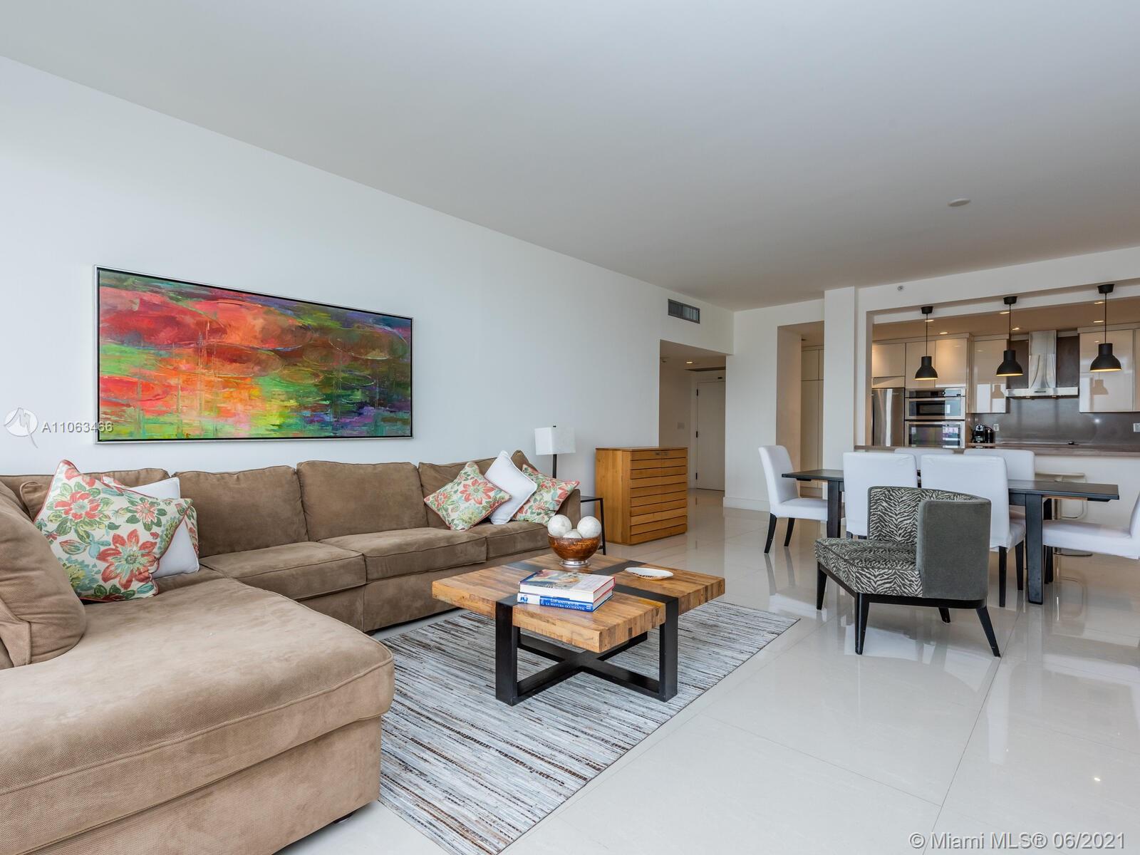 151 Crandon Boulevard, Unit 736 Key Biscayne, FL 33149 - Photo 17 of 38 a living room with furniture and a rug