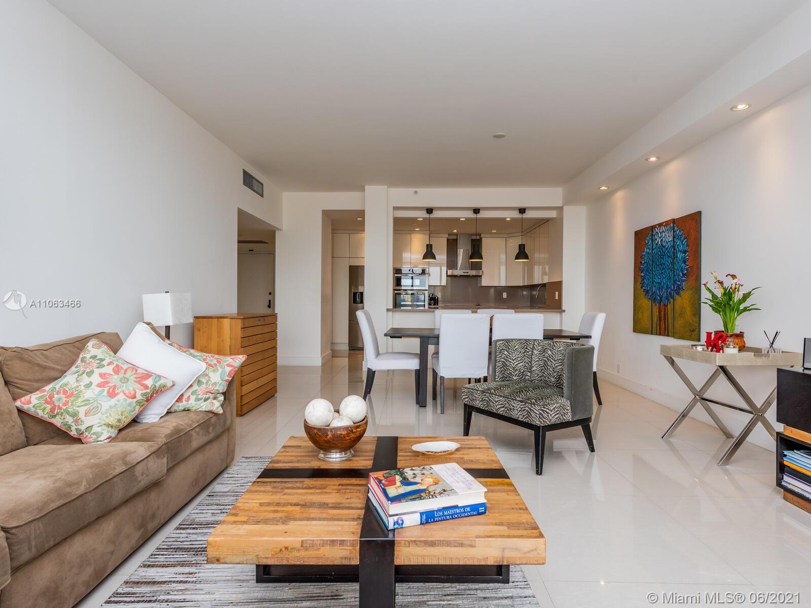 151 Crandon Boulevard, Unit 736 Key Biscayne, FL 33149 - Photo 19 of 38 a living room with furniture and a rug